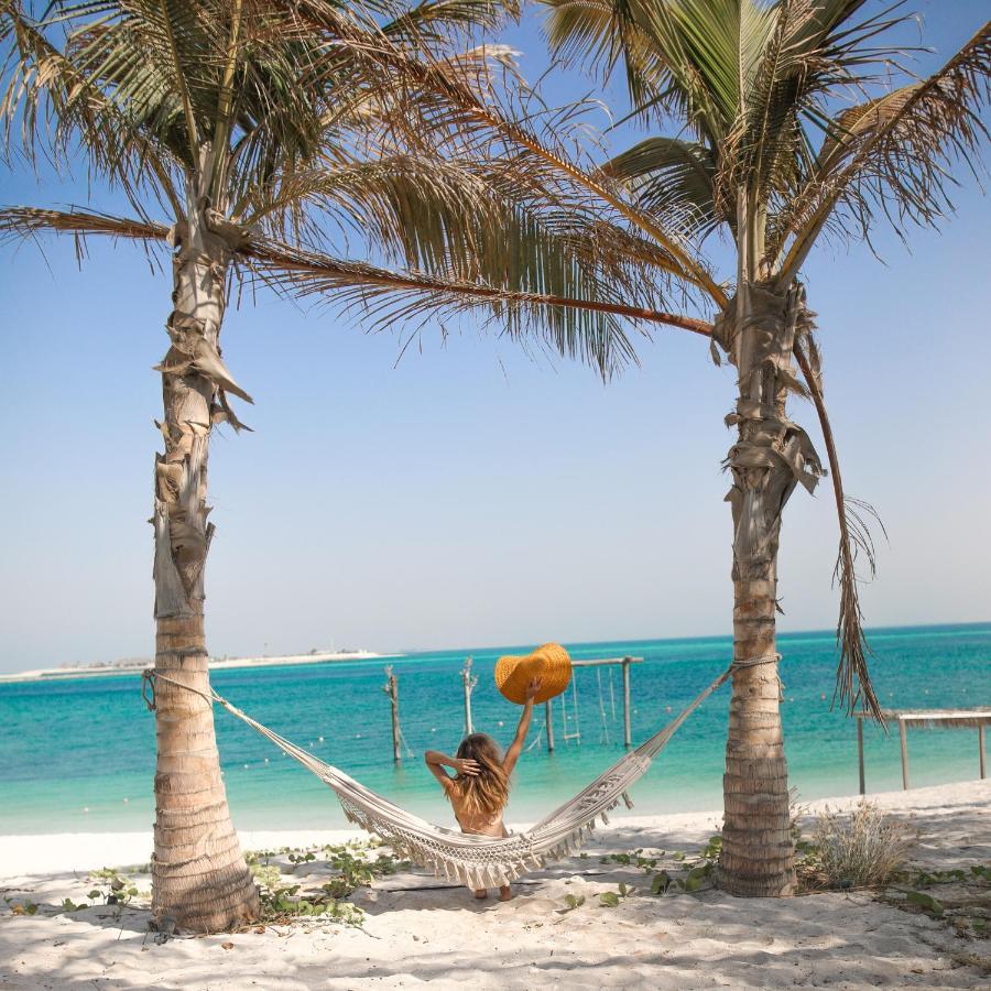 Nurai Island, Saadiyat Ξενοδοχείο Αμπού Ντάμπι Εξωτερικό φωτογραφία Hammock on the beach